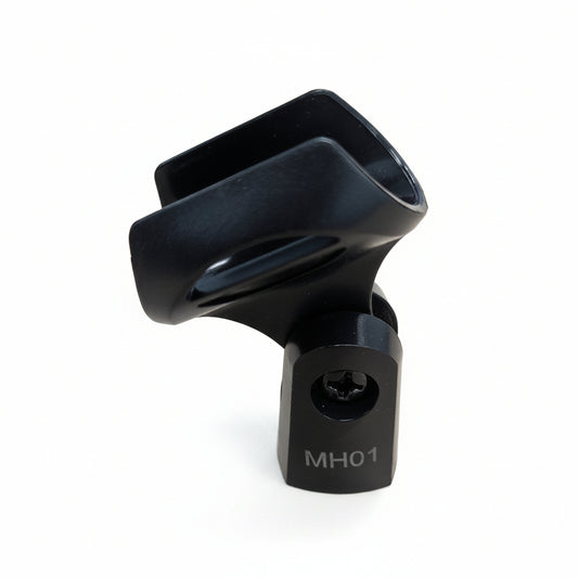 A black metal bicycle headset clamp with the model number MH01 printed on the base, shown on a light wood surface.